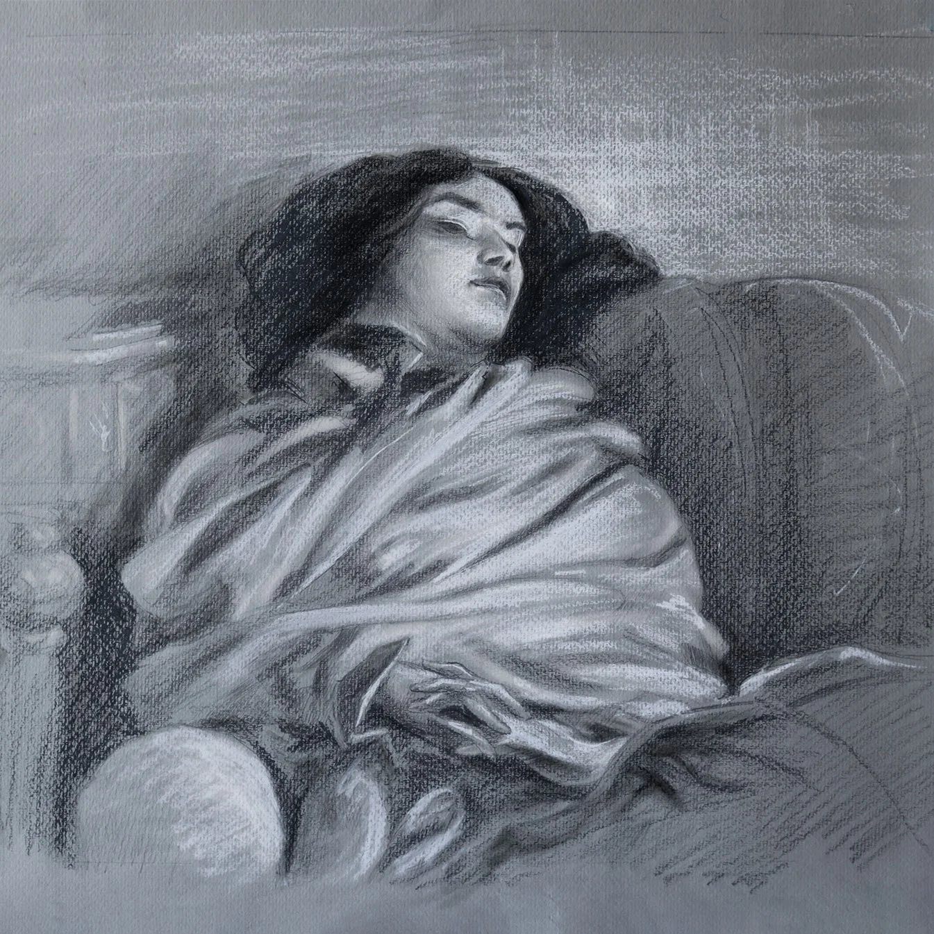 Graphite drawing of a reclining woman